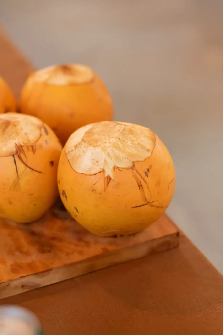 Fresh coconuts on a wooden board