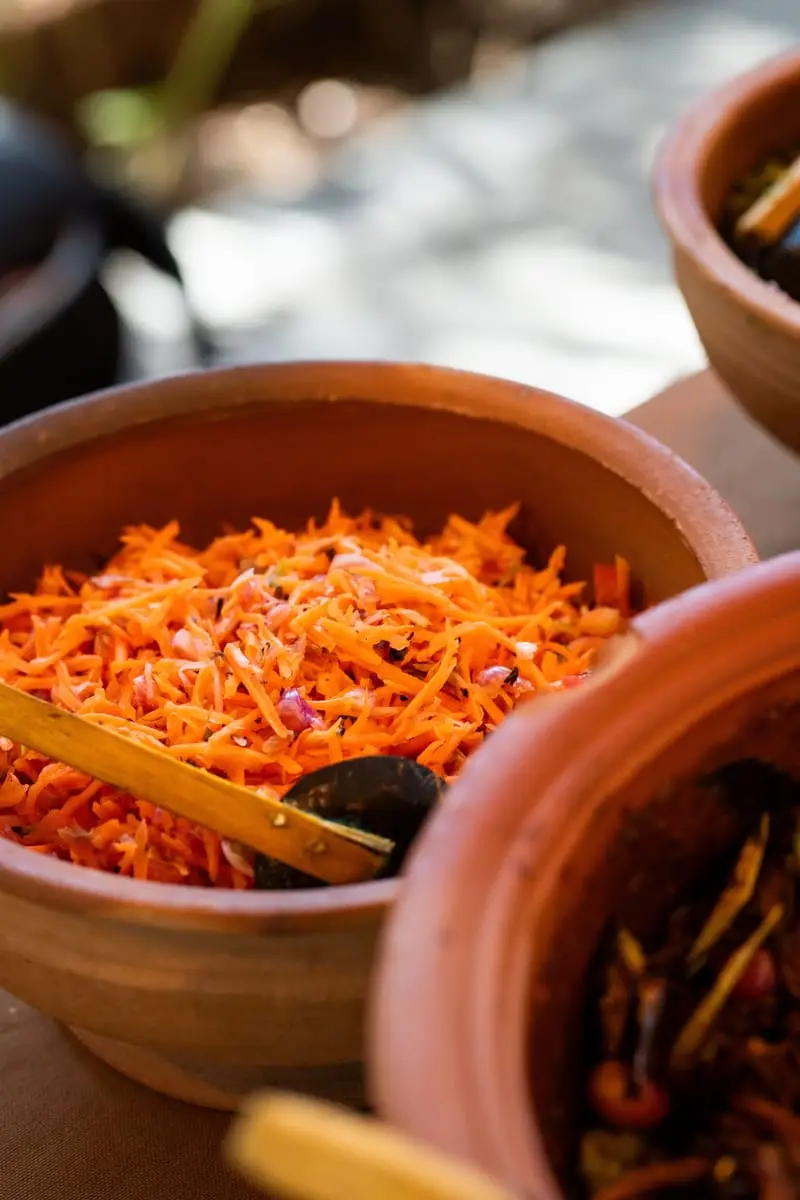 Grated carrot salad in a clay pot