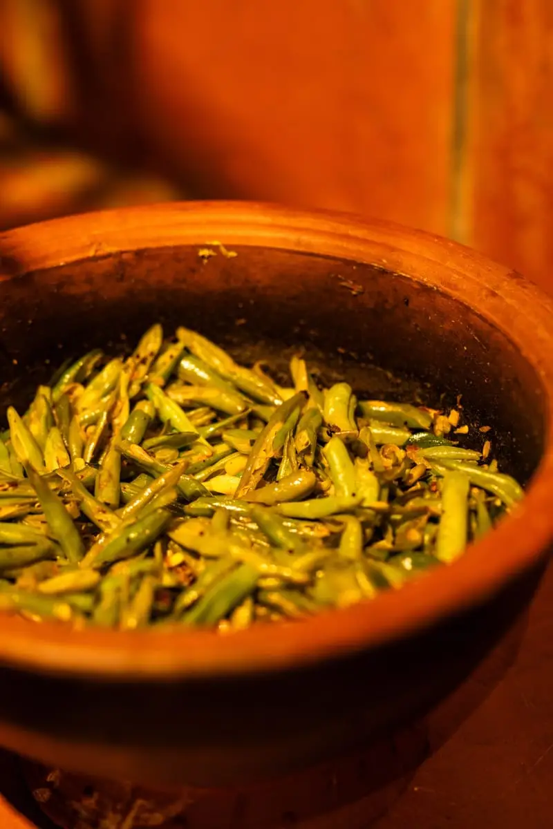 Green bean curry in a clay pot
