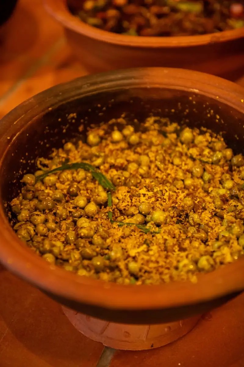Green peas with grated coconut in a clay pot