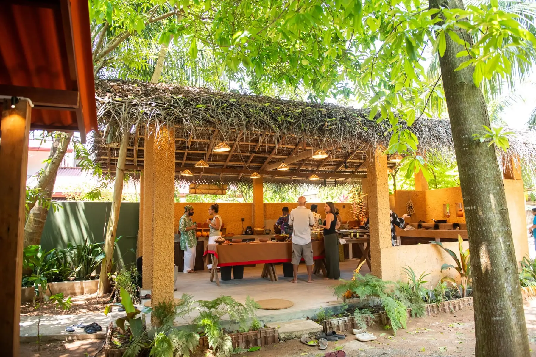 The thatched kitchen in its garden