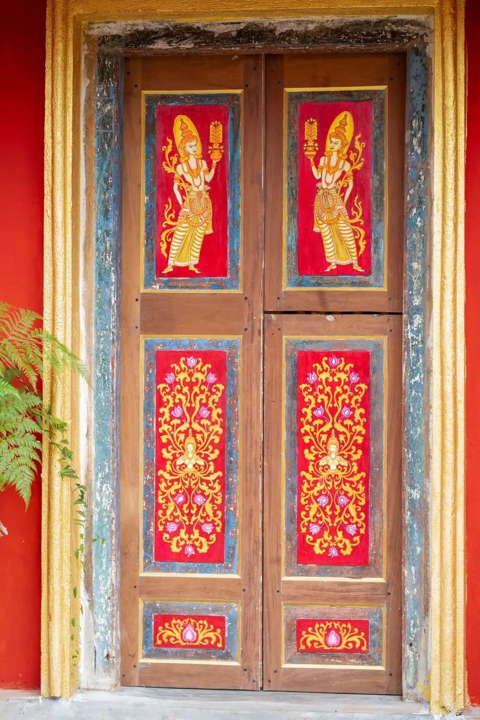 Hand-painted temple-style doors at the kitchen