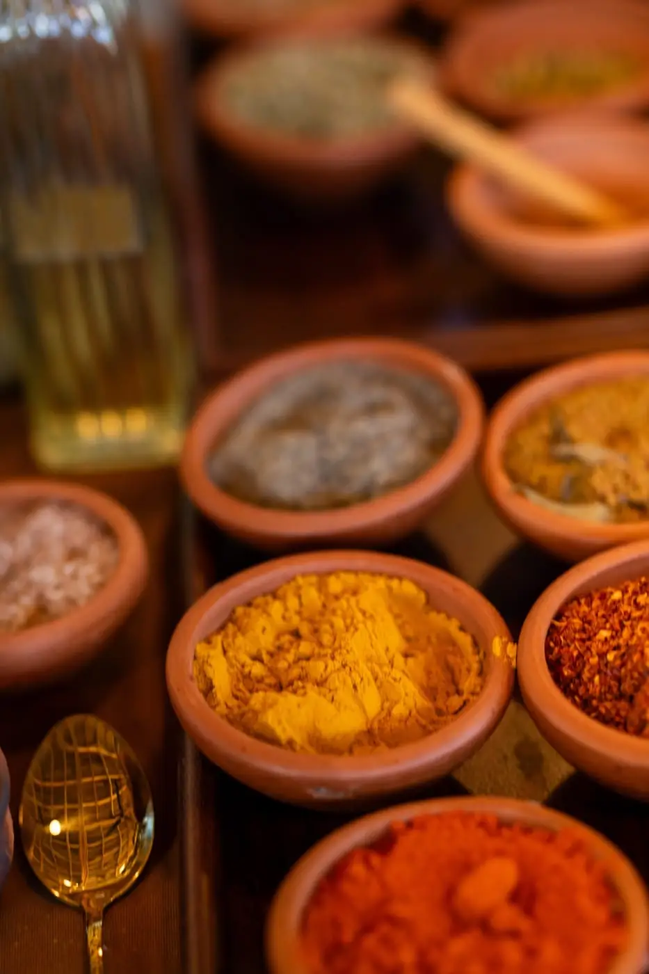 Clay bowls of whole and ground spices